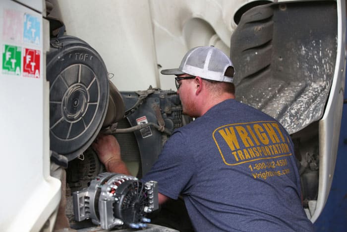 Wright transportation mechanic working on truck