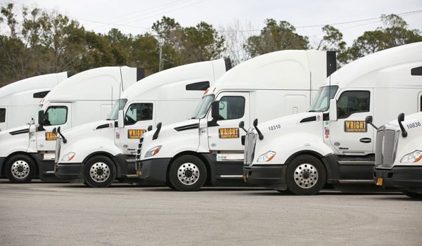 A row of semi trucks at Wright Transportation